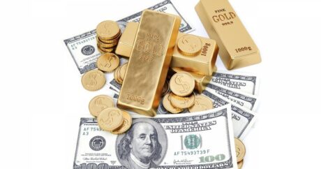 Золото умеренно подорожало на ослаблении доллара